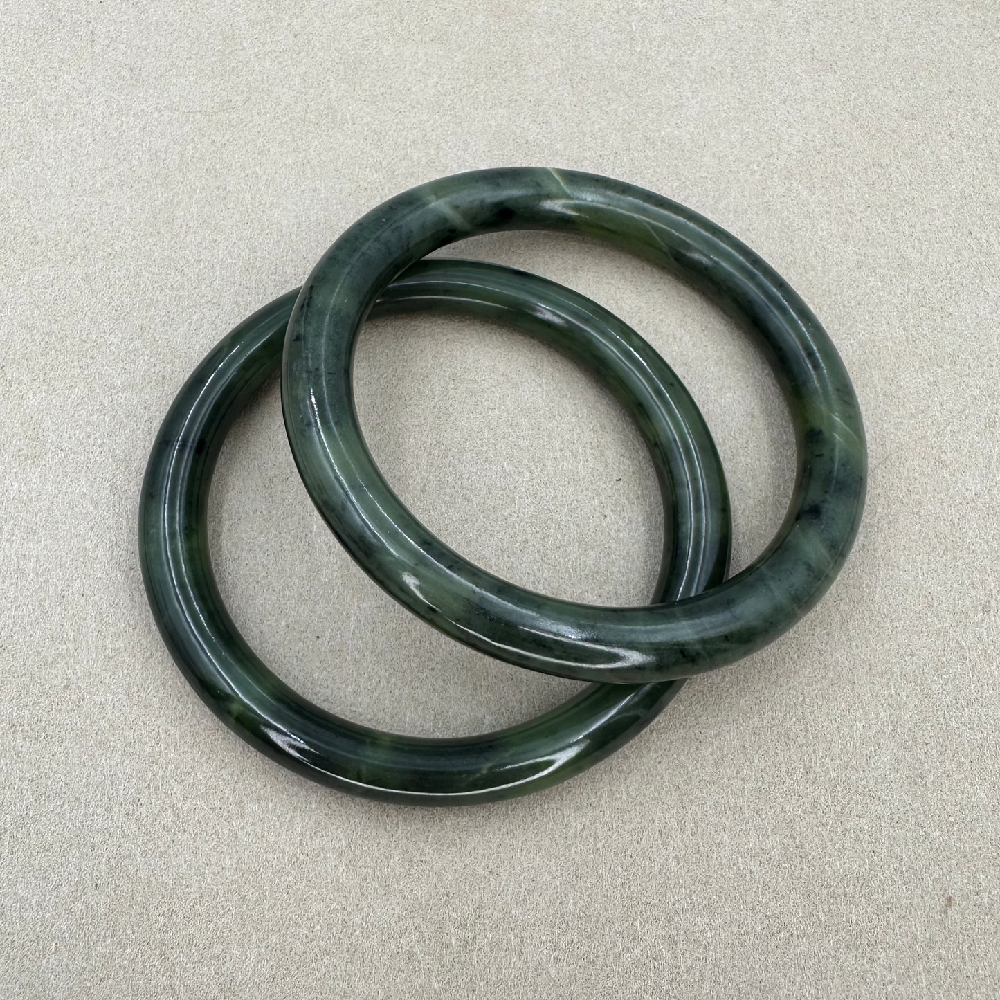 Pair of solid dark green Jade bangle bracelets
