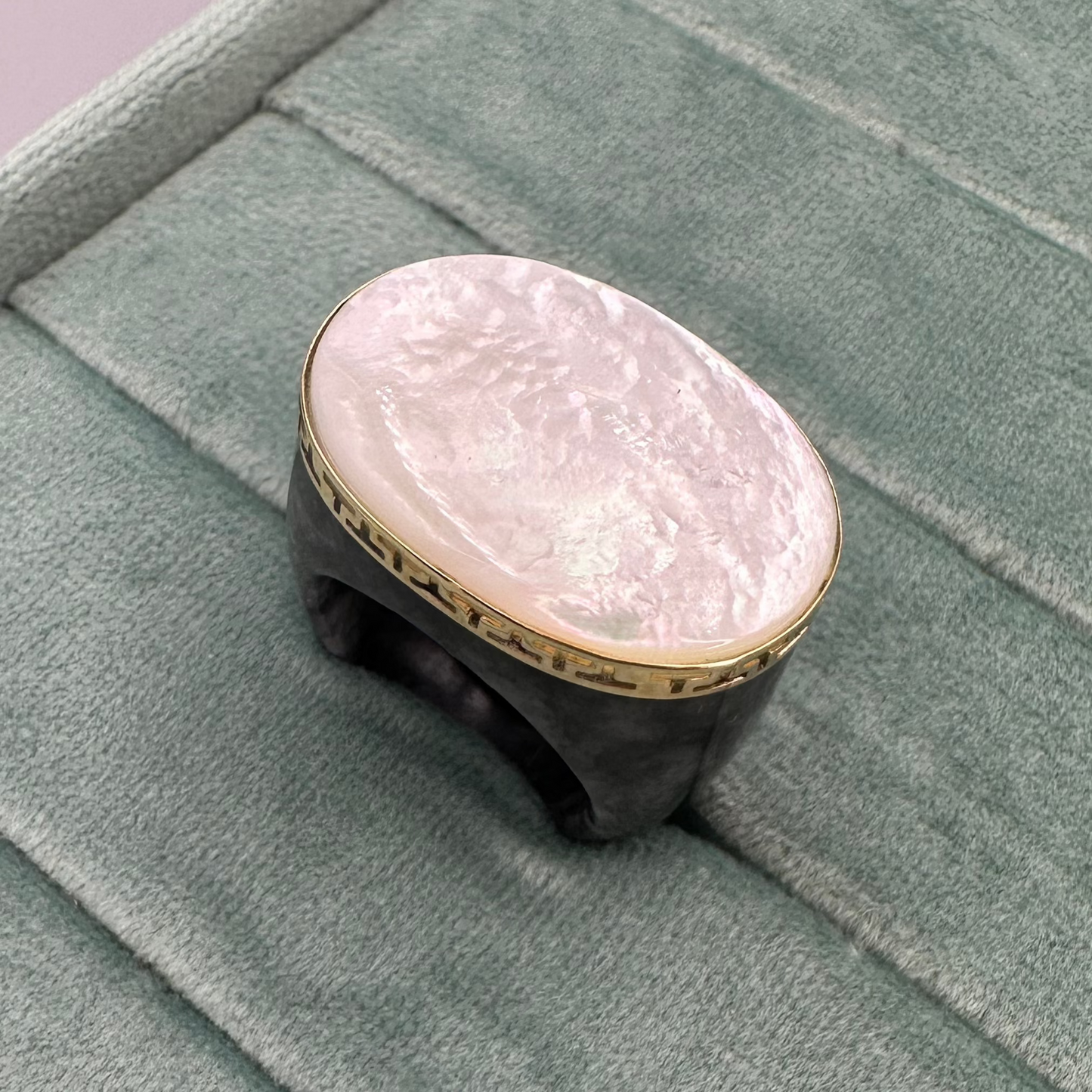 Large opal with black Jade ring